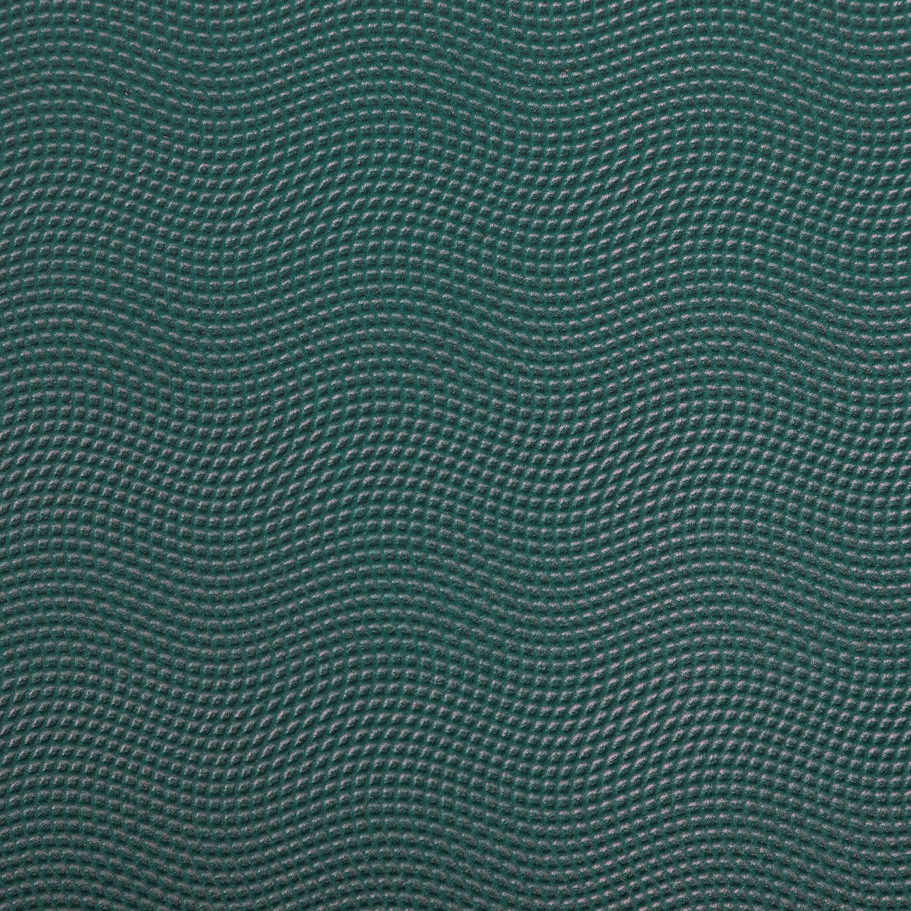 Nahaufnahme der fein strukturierten Oberfläche der EcoPro XL Yogamatte in Jungle Green mit wellenförmiger Prägung.
